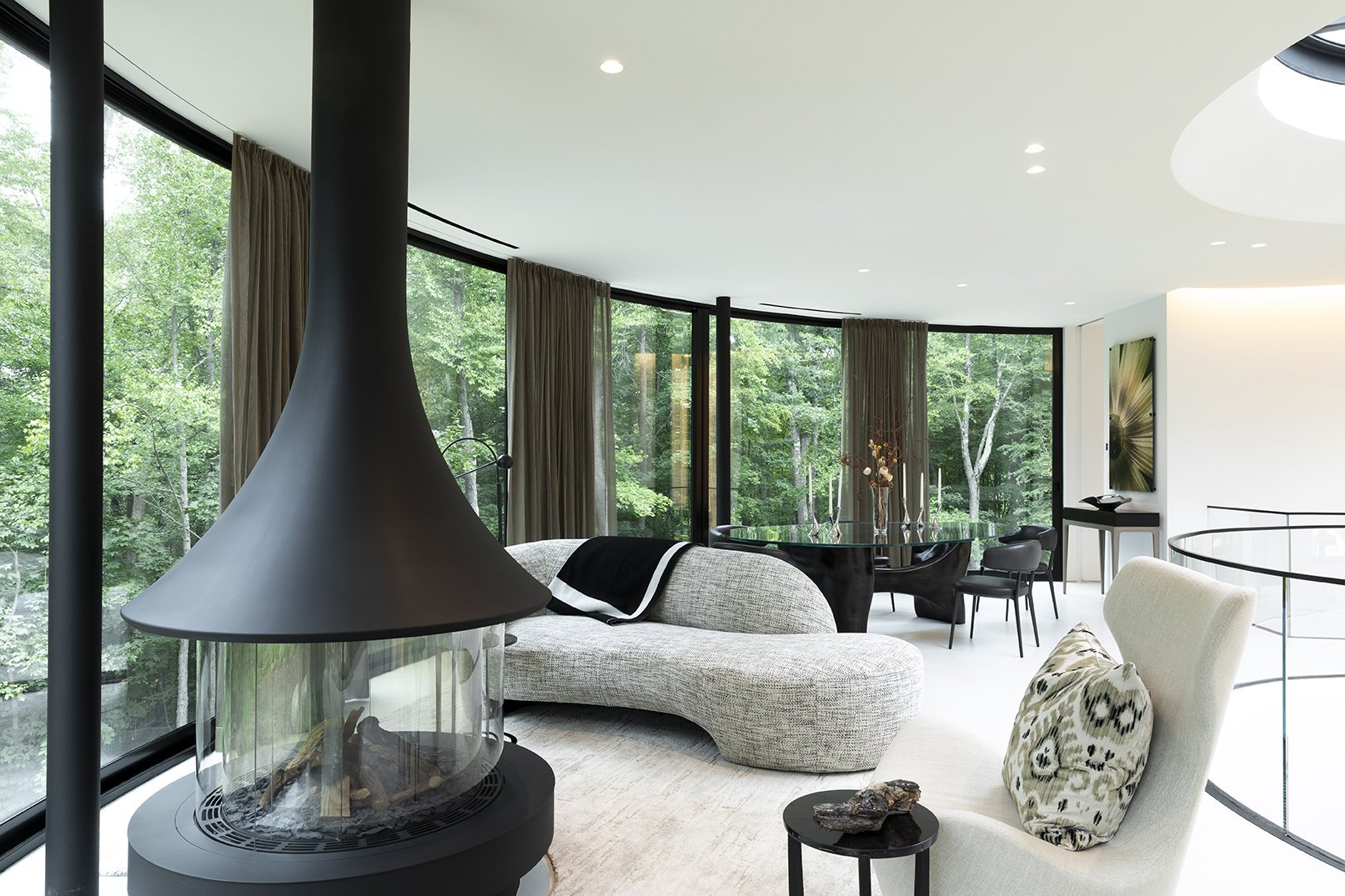 Modern wellness living room with natural elements and abundant greenery